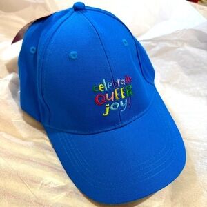 Anna Parade Blue Cap embroidered with “Celebrate Queer Joy” OS. Adjustable. NWT.